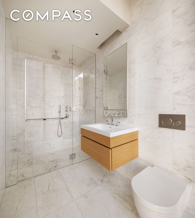 bathroom featuring tile walls, vanity, toilet, and walk in shower