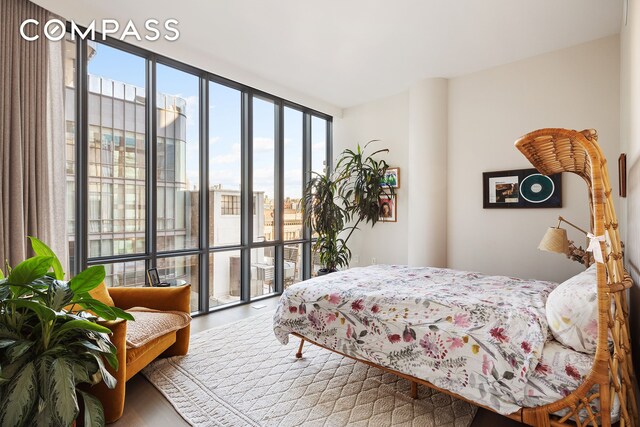 bedroom featuring floor to ceiling windows