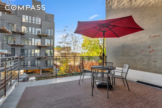 view of patio featuring a balcony