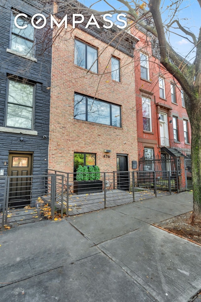 view of building exterior featuring a fenced front yard