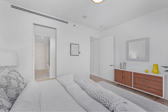 bedroom with light wood-type flooring