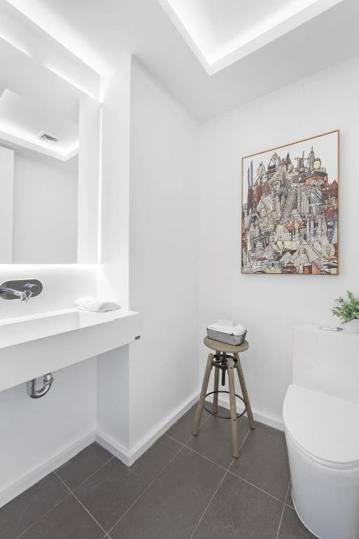 bathroom featuring tile patterned floors and toilet