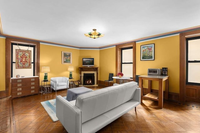 living room featuring ornamental molding and parquet flooring