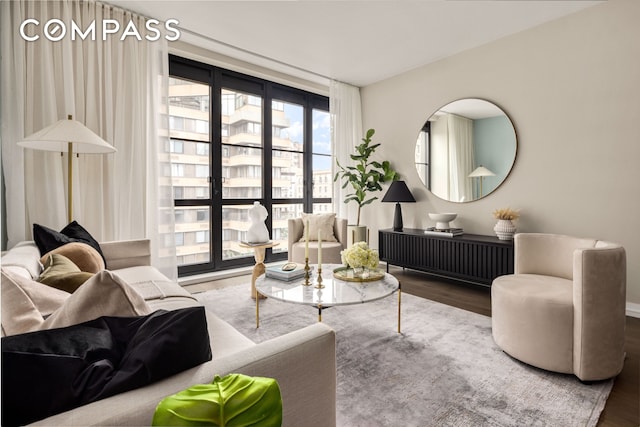 living room with a view of city and wood finished floors