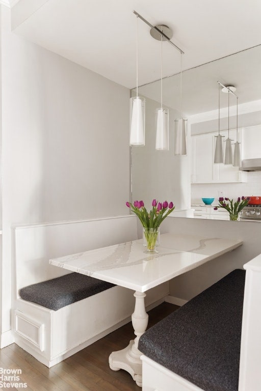 bathroom featuring hardwood / wood-style floors and breakfast area