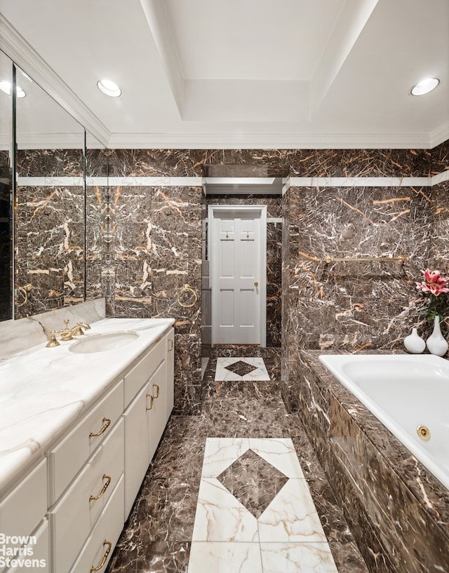 full bath featuring tiled bath, vanity, tile walls, marble finish floor, and recessed lighting