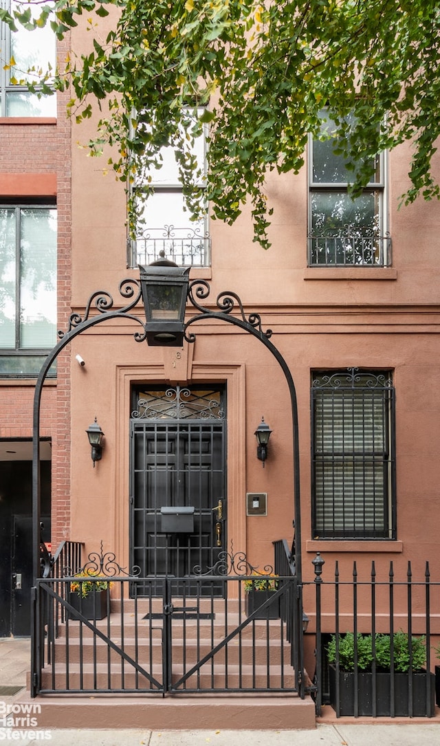 doorway to property with a gate