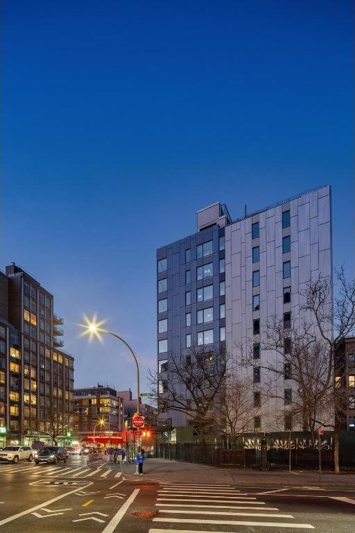 view of outdoor building at dusk