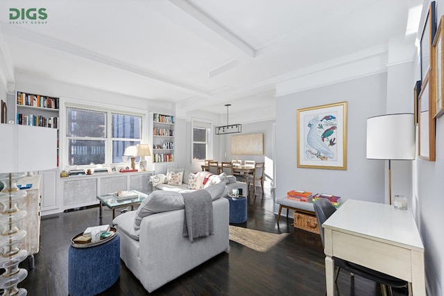 living room featuring beam ceiling, built in features, and dark wood-type flooring