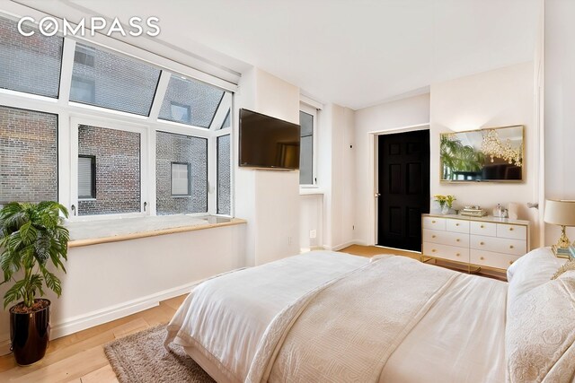 bedroom with light hardwood / wood-style flooring