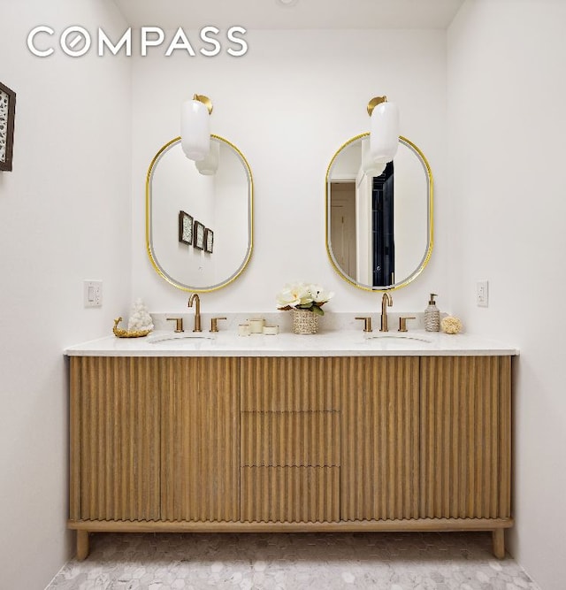 bathroom with double vanity and a sink