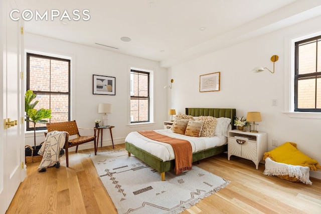 bedroom with wood finished floors