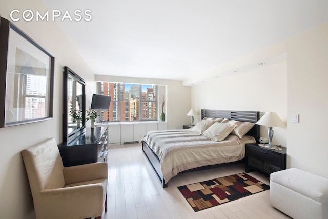 bedroom with light wood finished floors