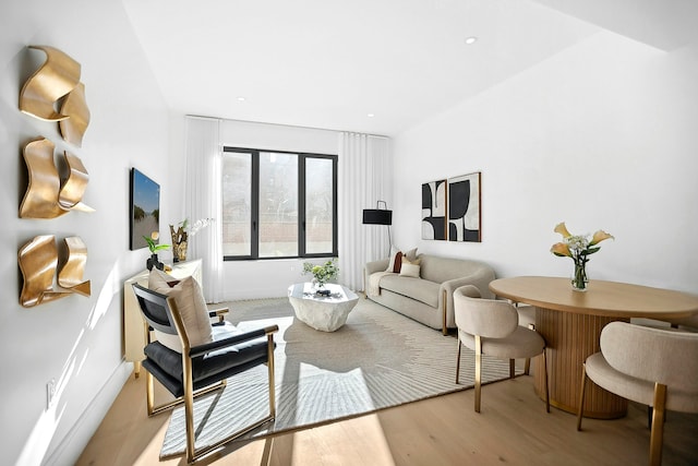 living room with recessed lighting and wood finished floors