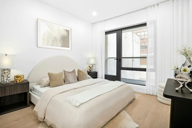 bedroom with light wood-type flooring