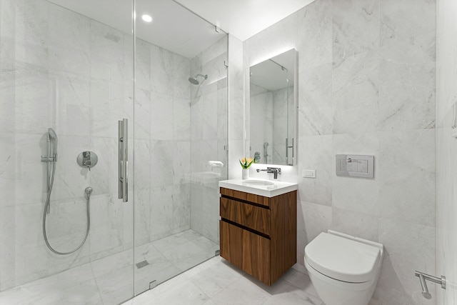 244 E 52nd St Unit 3C, New York City, NY 10022 - full bath featuring tile walls, a shower stall, vanity, and toilet