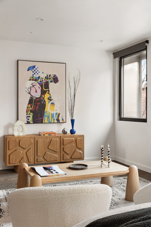 living room with baseboards and wood finished floors