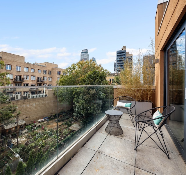 balcony featuring a city view