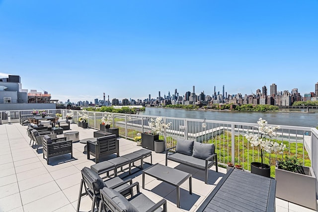 30-05 Vernon Blvd Unit 2-H, New York City, NY 11102 - view of patio / terrace with an outdoor hangout area, a skyline view, and a water view