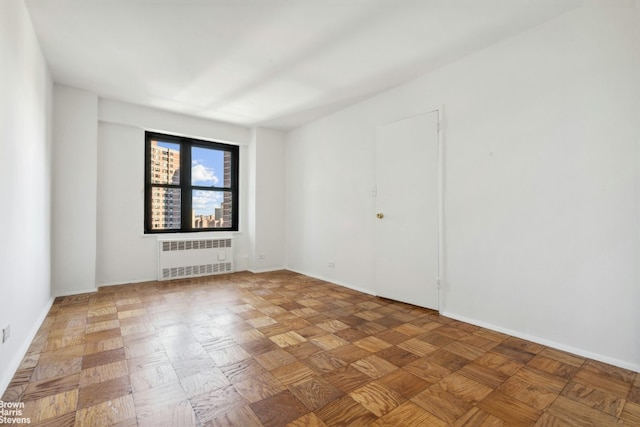 spare room with radiator heating unit