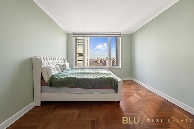 bedroom with dark parquet floors and crown molding