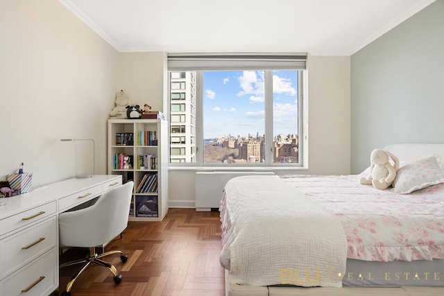 bedroom with crown molding, radiator heating unit, and parquet flooring