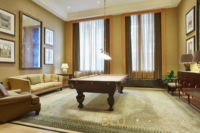 game room with light carpet, billiards, and ornamental molding