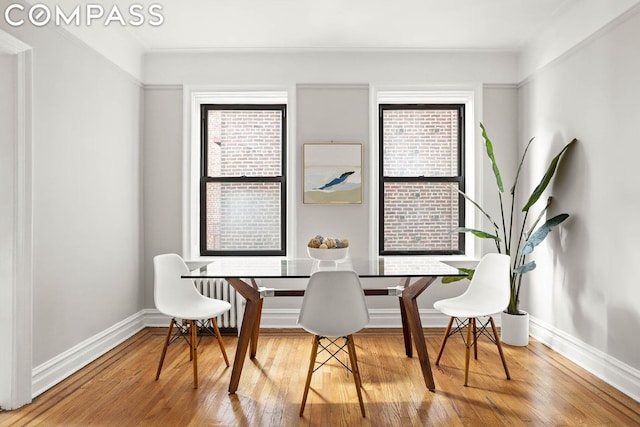 dining space featuring wood-type flooring