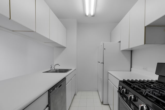 kitchen featuring range with gas cooktop, white cabinets, dishwasher, and sink