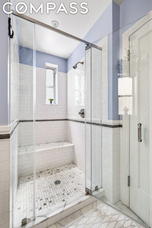 bathroom featuring walk in shower