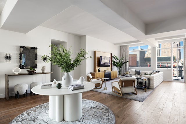 living area with wood finished floors and baseboards