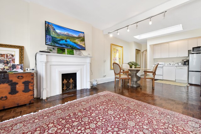 miscellaneous room with a wall unit AC and light hardwood / wood-style flooring