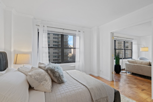 bedroom with parquet flooring and ornamental molding