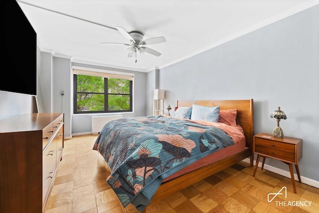 bedroom featuring ceiling fan, light parquet floors, radiator heating unit, and ornamental molding