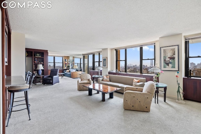 carpeted living room featuring a textured ceiling