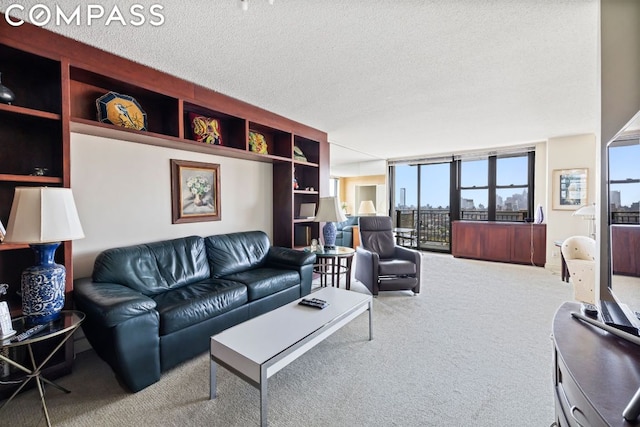 carpeted living room featuring a textured ceiling