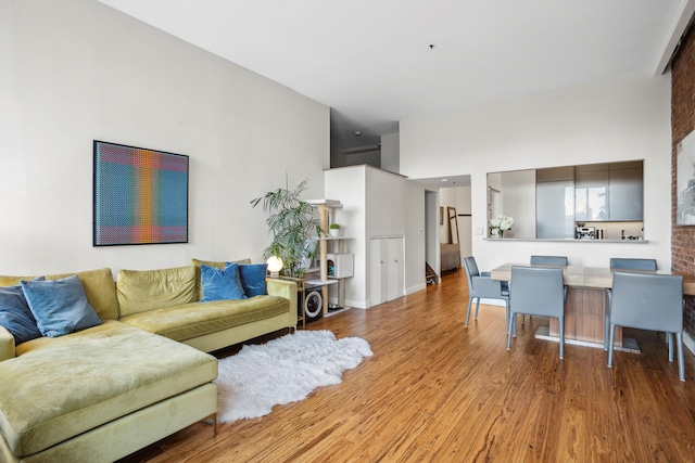 living room with baseboards and wood finished floors