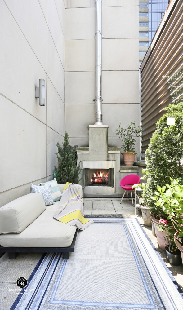 view of patio / terrace featuring a multi sided fireplace