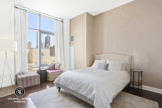 bedroom featuring dark wood-type flooring