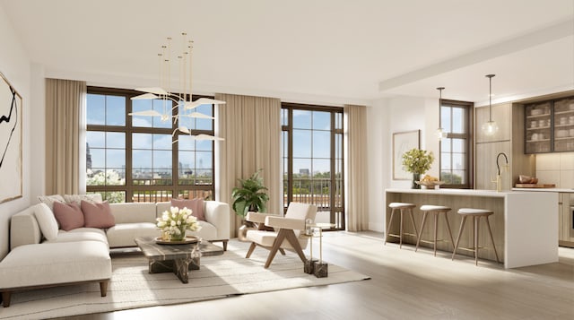 living room featuring sink, light hardwood / wood-style floors, and floor to ceiling windows