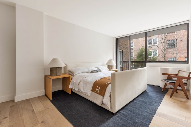 bedroom with hardwood / wood-style floors