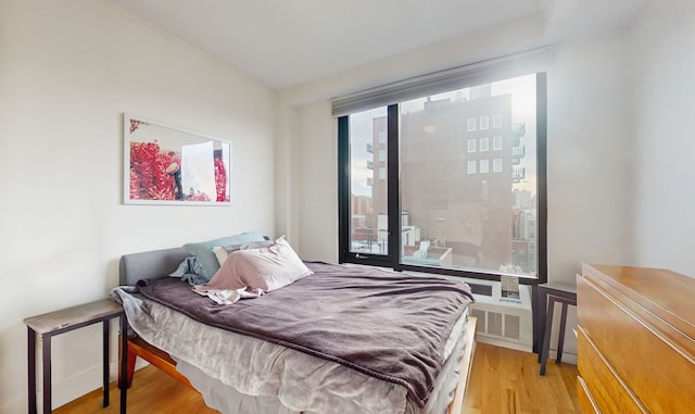 bedroom with light wood finished floors