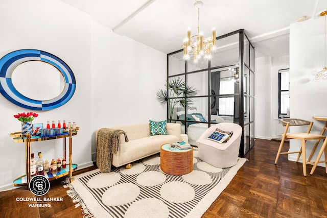 living room featuring dark parquet flooring and a chandelier