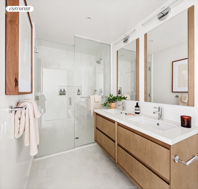 bathroom with vanity, tile patterned flooring, and walk in shower