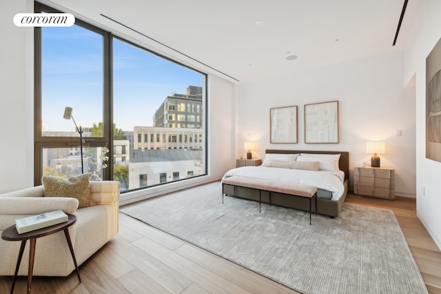 68 Commercial St Ph, Ph, New York City, NY 11222 - bedroom featuring wood finished floors and expansive windows