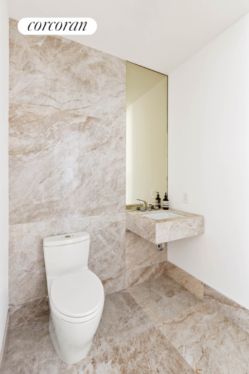 bathroom with tile patterned floors and toilet