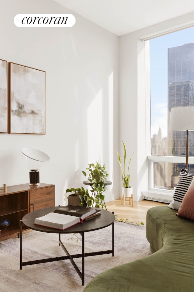 15 Hudson Yards Unit 67F, New York City, NY 10001 - living room with plenty of natural light, wood finished floors, and a view of city