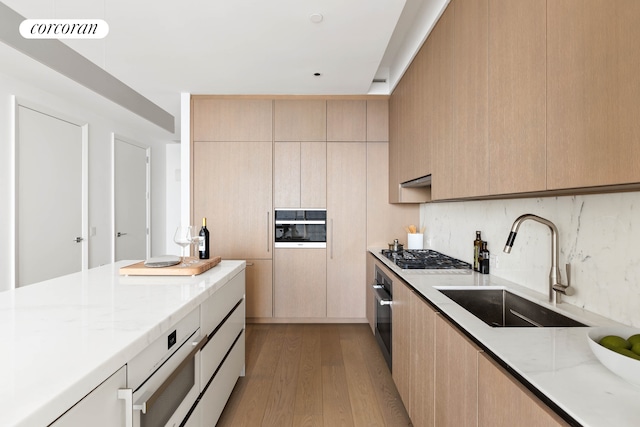 15 Hudson Yards Unit 67F, New York City, NY 10001 - kitchen featuring appliances with stainless steel finishes, a sink, modern cabinets, and light brown cabinetry
