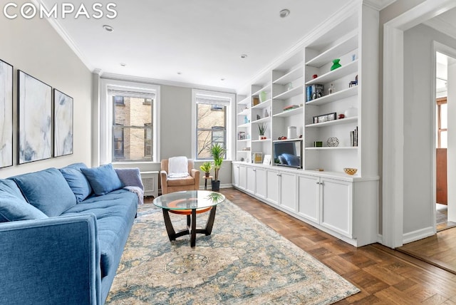 living room with wood-type flooring, built in features, and ornamental molding