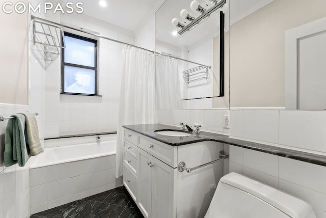 full bathroom with vanity, shower / tub combo, tile walls, toilet, and ornamental molding